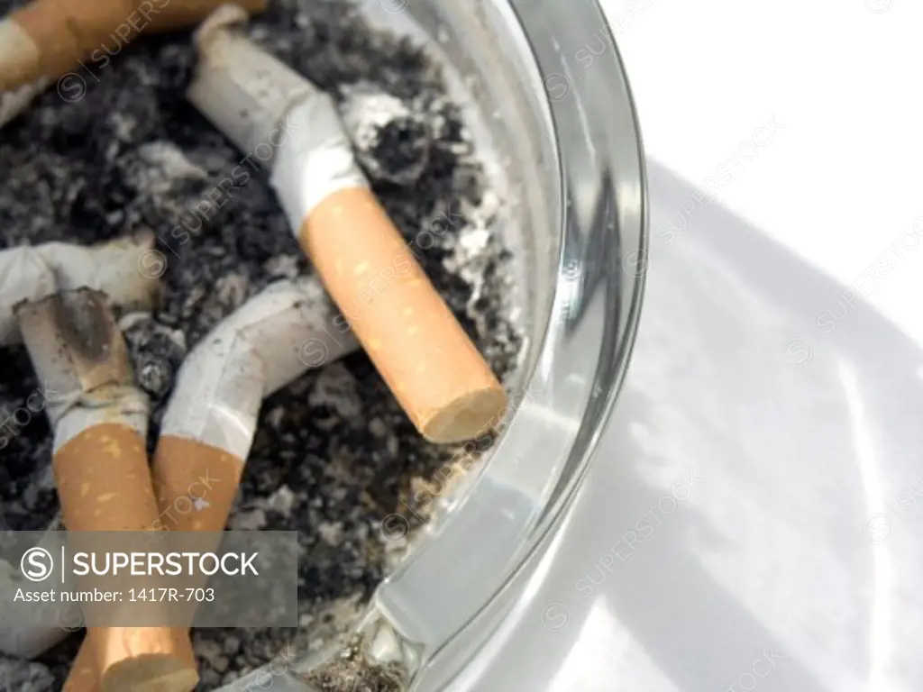 Close-up of cigarette butts in an ashtray