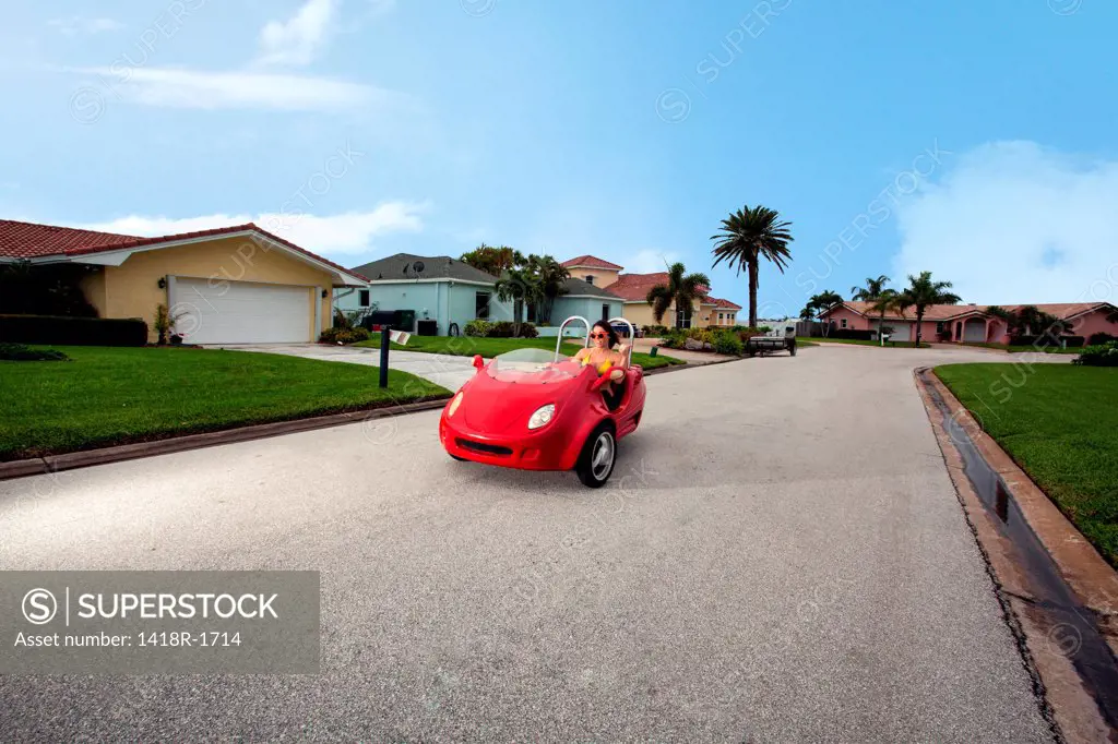 USA, Florida, Orlando, Woman riding red motorcycle