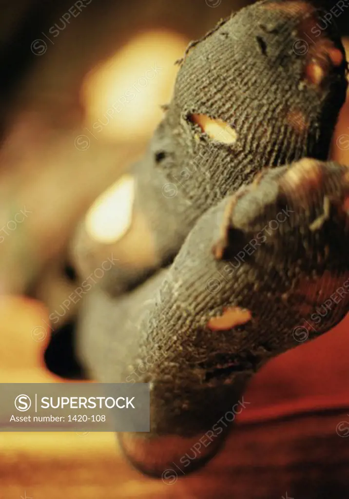 Close-up of the feet of a person wearing torn socks