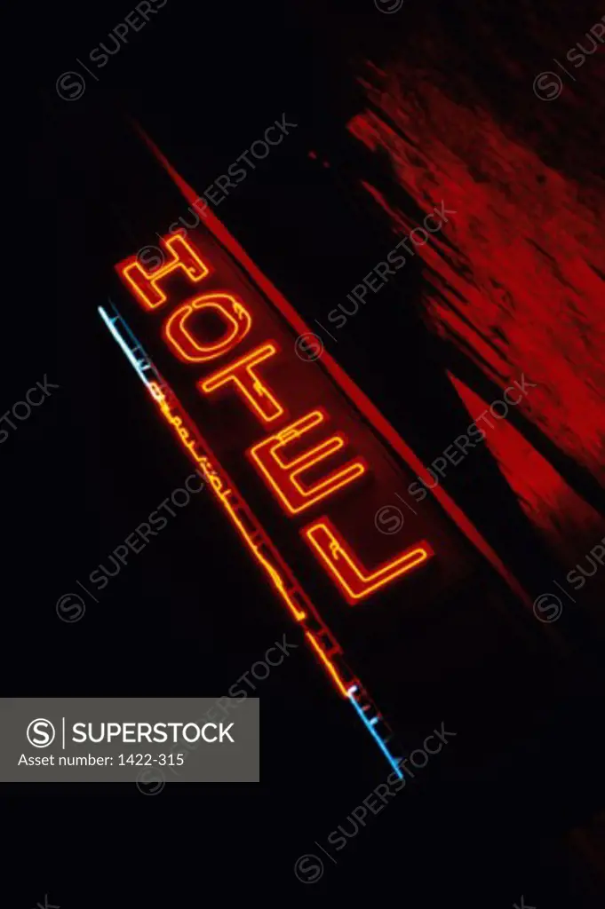 Low angle view of a neon hotel sign