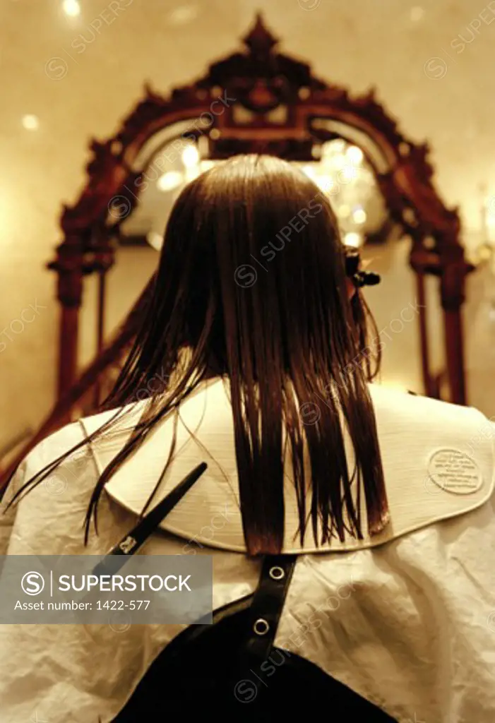 Rear view of a woman sitting in a hair salon