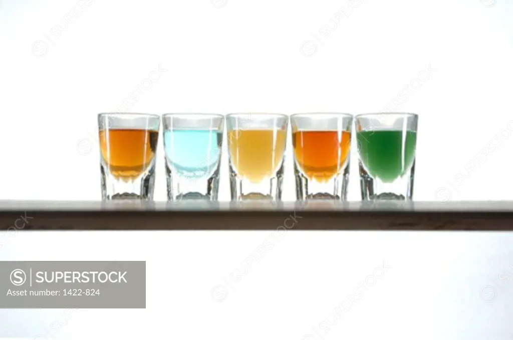 Close-up of shot glasses and alcohol