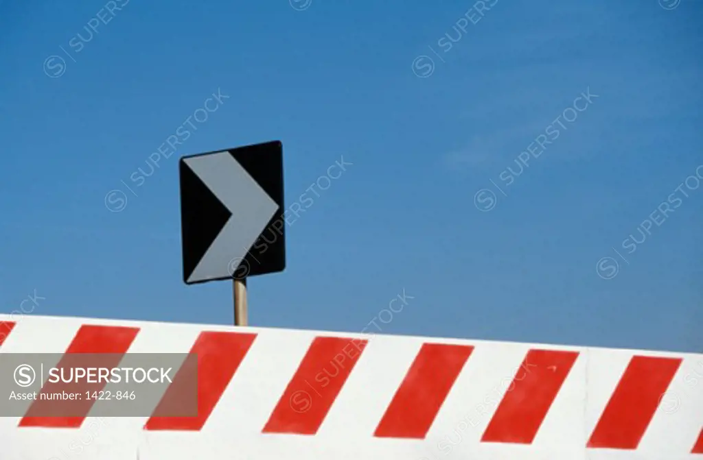 Close-up of a chevron road sign