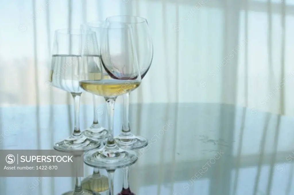 Four wineglasses on a table
