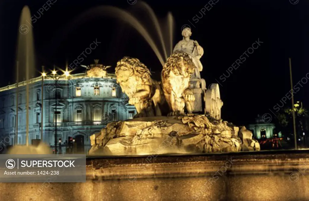 Statue on a fountain lit up at night, Cibeles Fountain, Plaza de Cibeles, Madrid, Spain