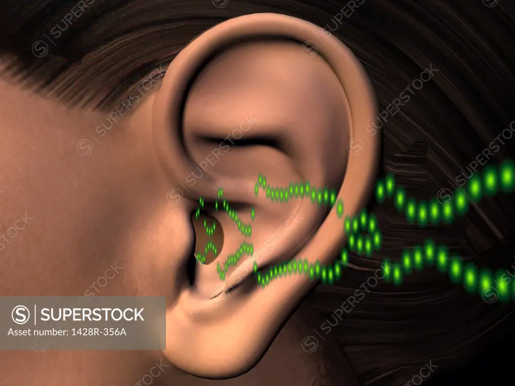 Close-up of a human ear listening to sound waves