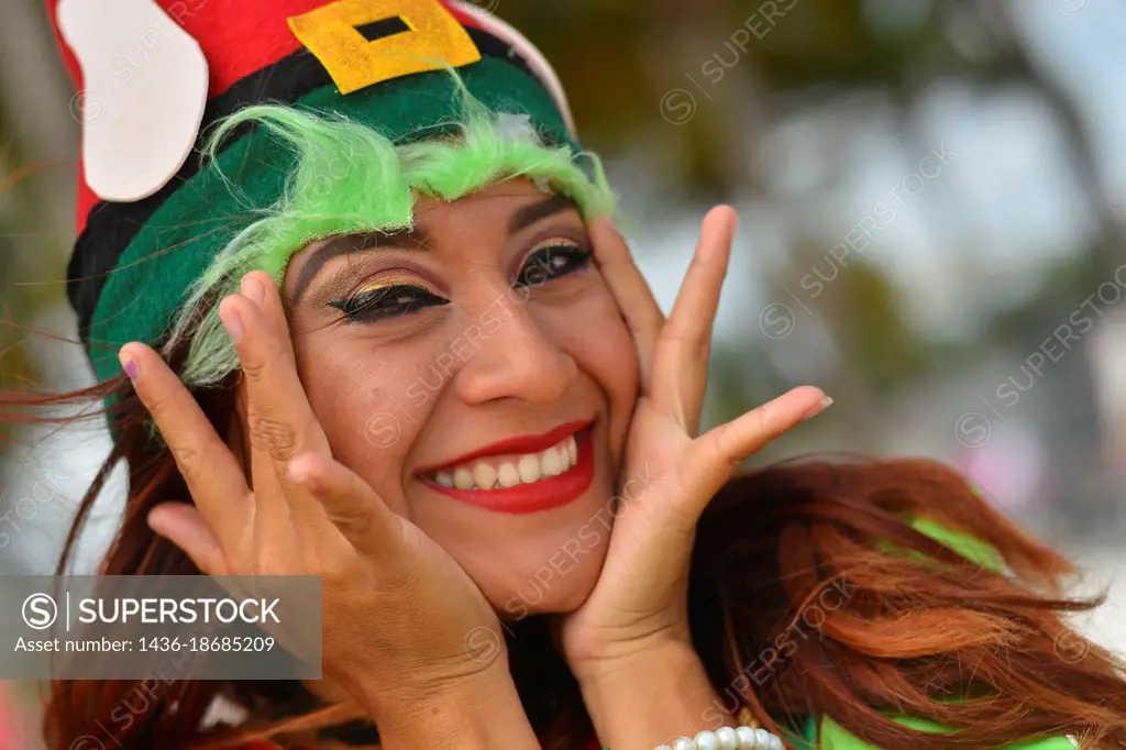 Young and pretty Mexican masked girl smiles.
