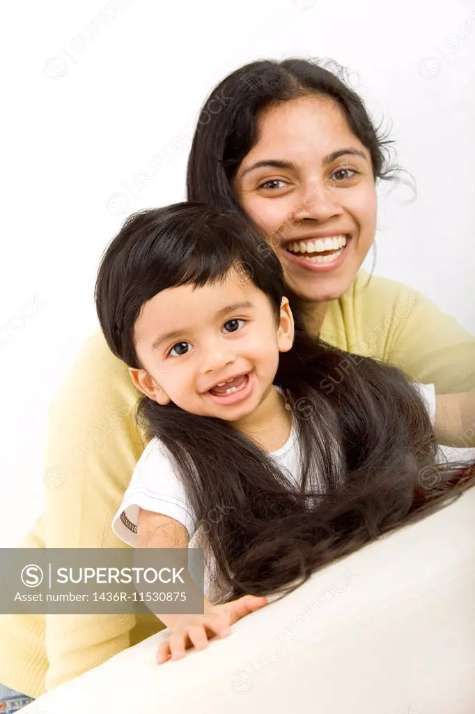 indian mom with very long hair and toddler.