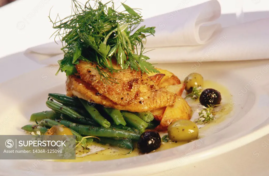 Halibut cheeks with olive oil, olives and summer green beans