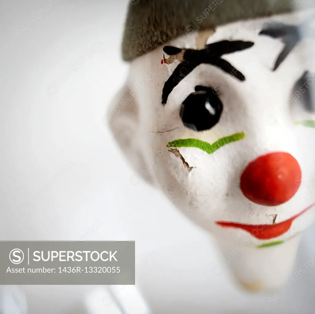 Close-up of a face of a clown puppet.