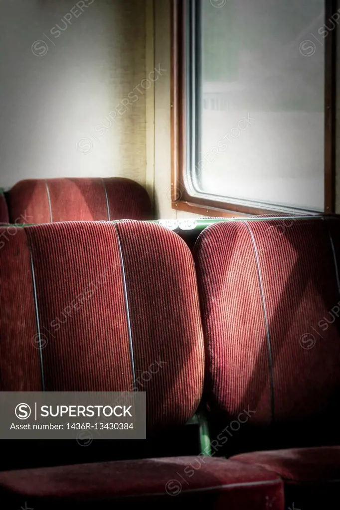 Empty seats in old retro railway carriage. Vintage transportation.