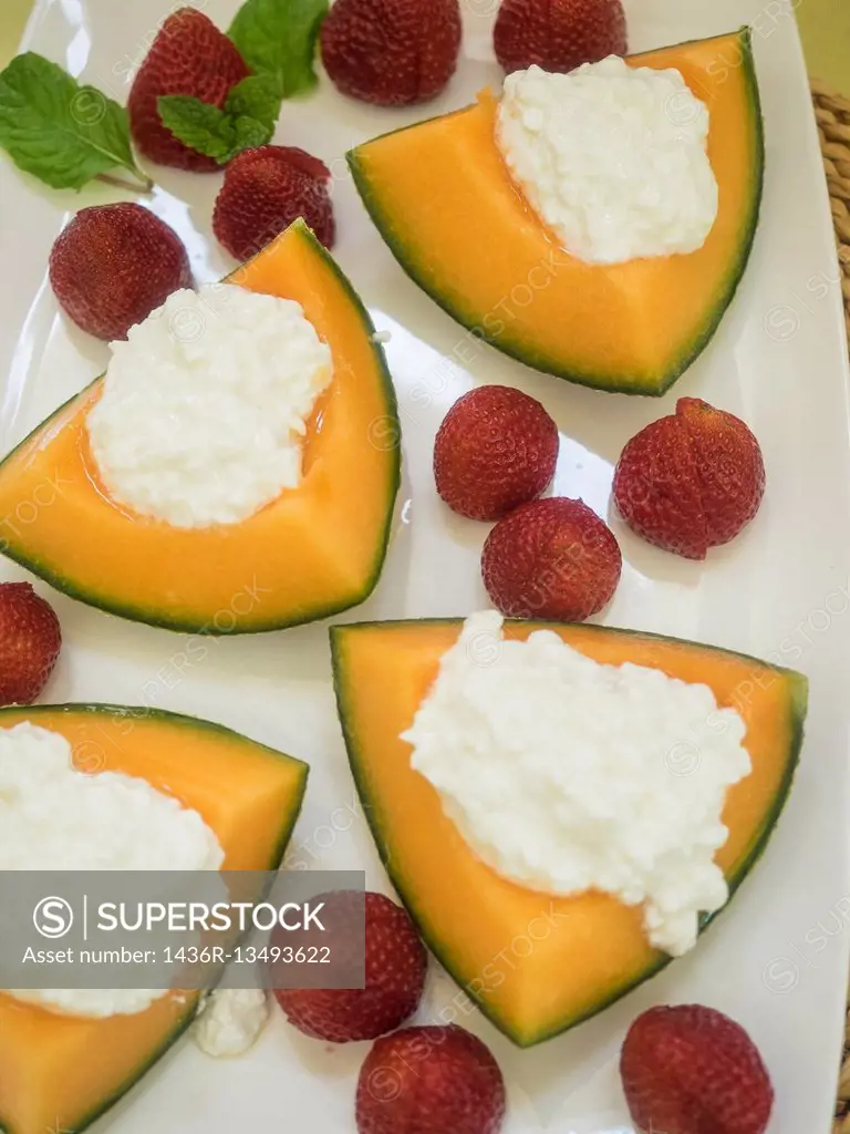 Cantaloupe and cottage cheese.