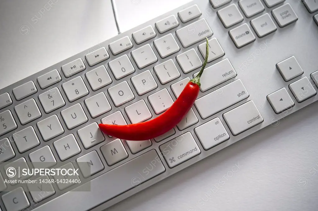 Red hot pepper on a computer keyboard.