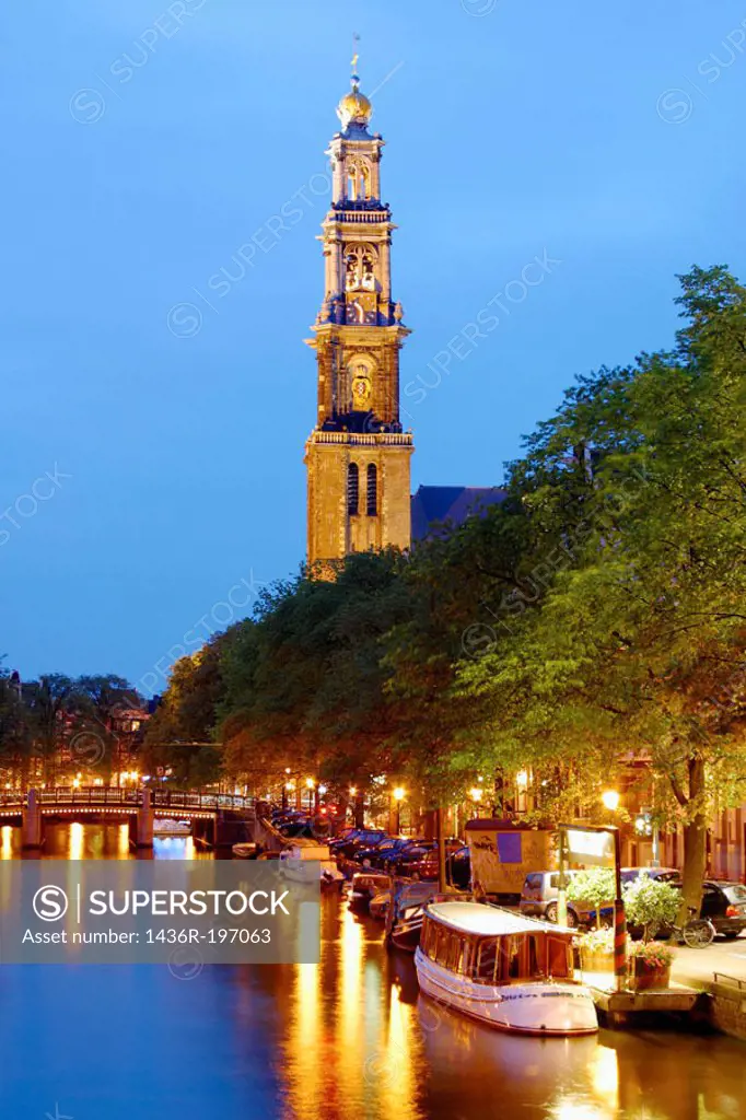 View down Prinsengacht to Westerkerk at night. Amsterdam. Holland