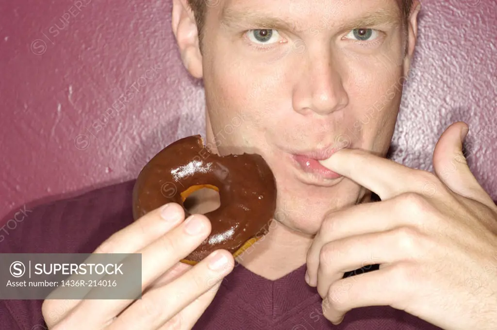 Man eating donut