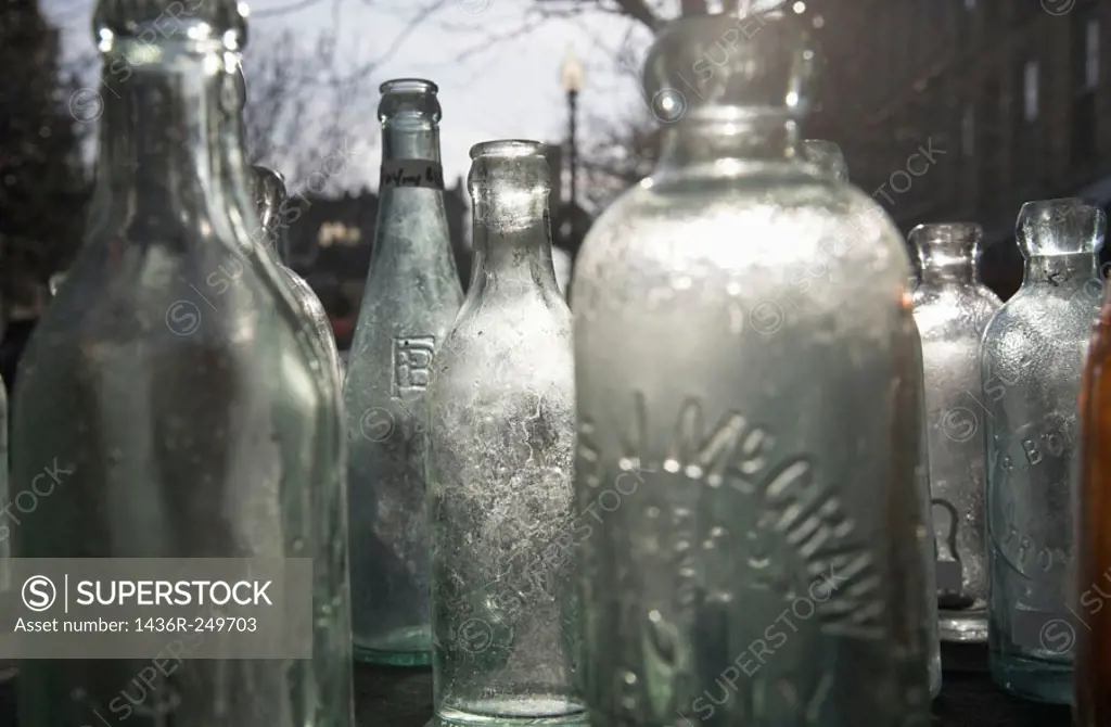 Antique bottles in wooden box