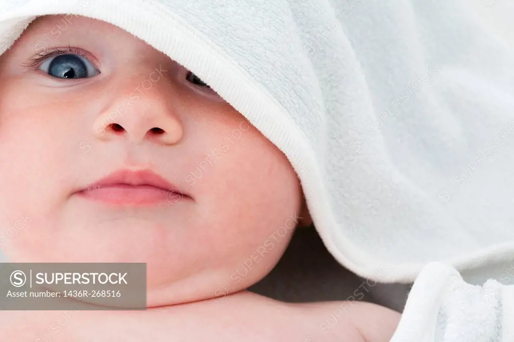 Baby Looking at Camera with Towel over head