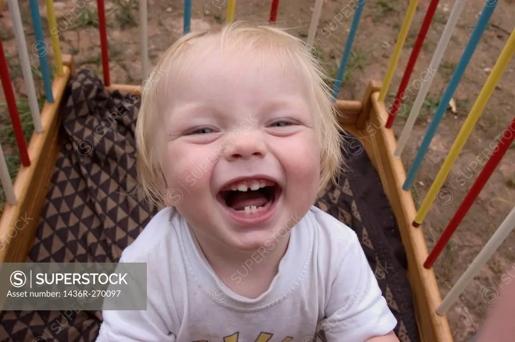 Boy laughing showing teeth