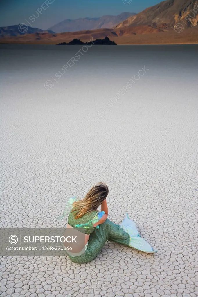 Usa. California. Death Valley National Park. Racetrack point. Woman with Mermaid costume