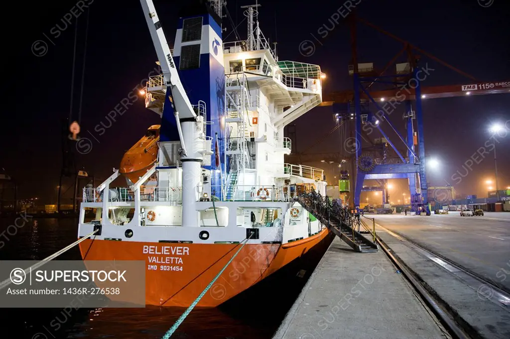 Loading cargo containers in ship, Port of Bilbao, Santurtzi. Biscay, Euskadi, Spain