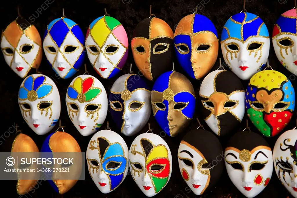 Venetian carnival mask display in a market near Rialto, San Polo, Venice, Veneto, Italy