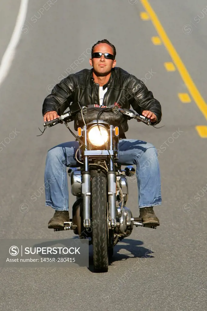 Man riding his Harley Davidson Motorcycle
