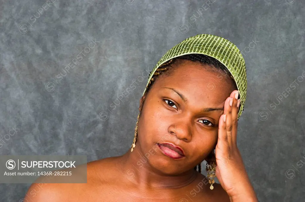 Young black woman with her hand on her face