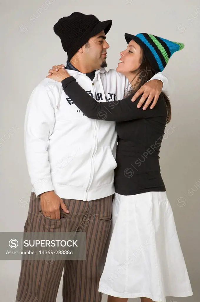 Latin young couple looking at each other