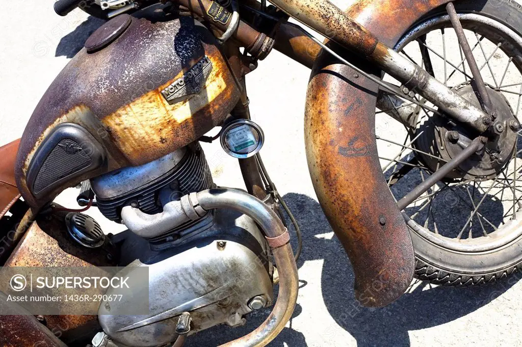 An old and rusty vintage motorcycle