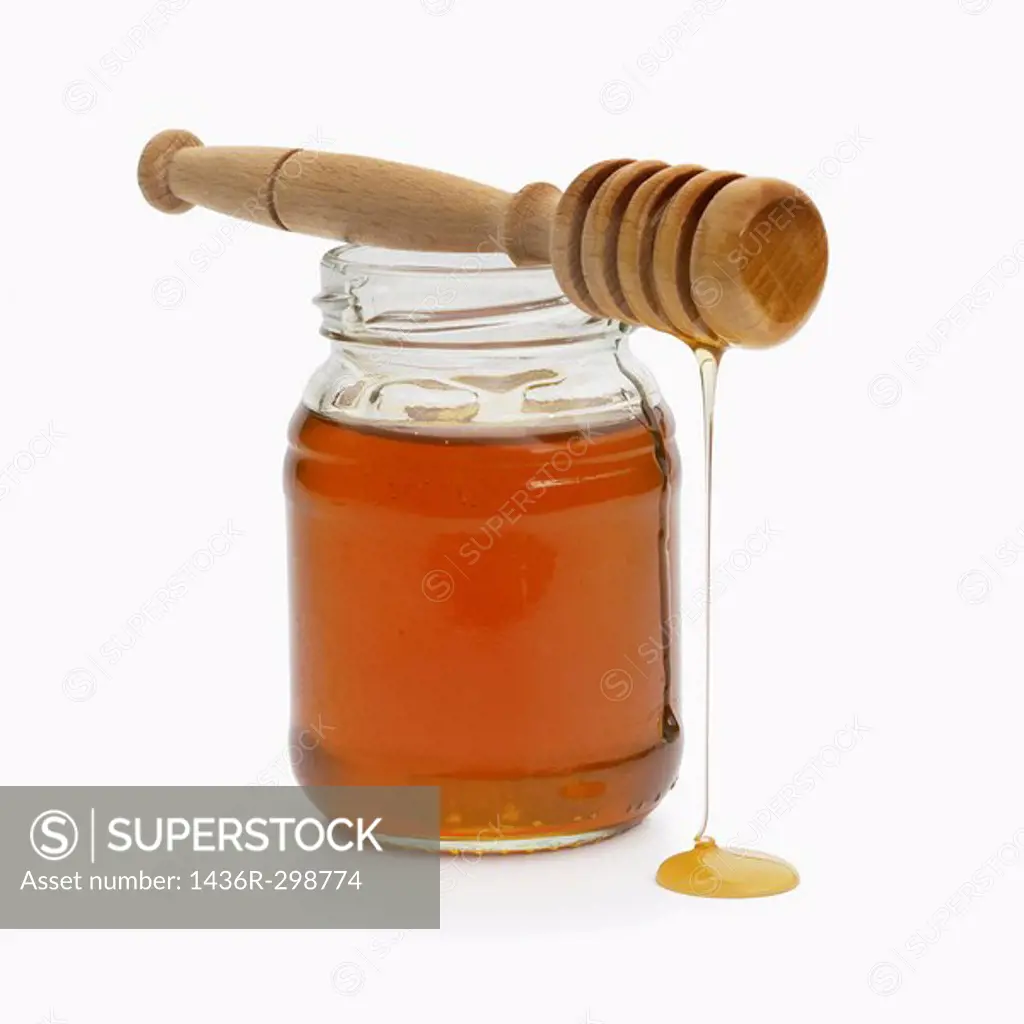 Jar of honey with drizzler