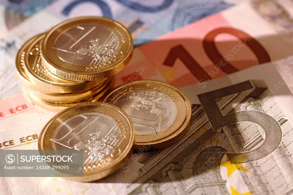 Euro coins on euro notes