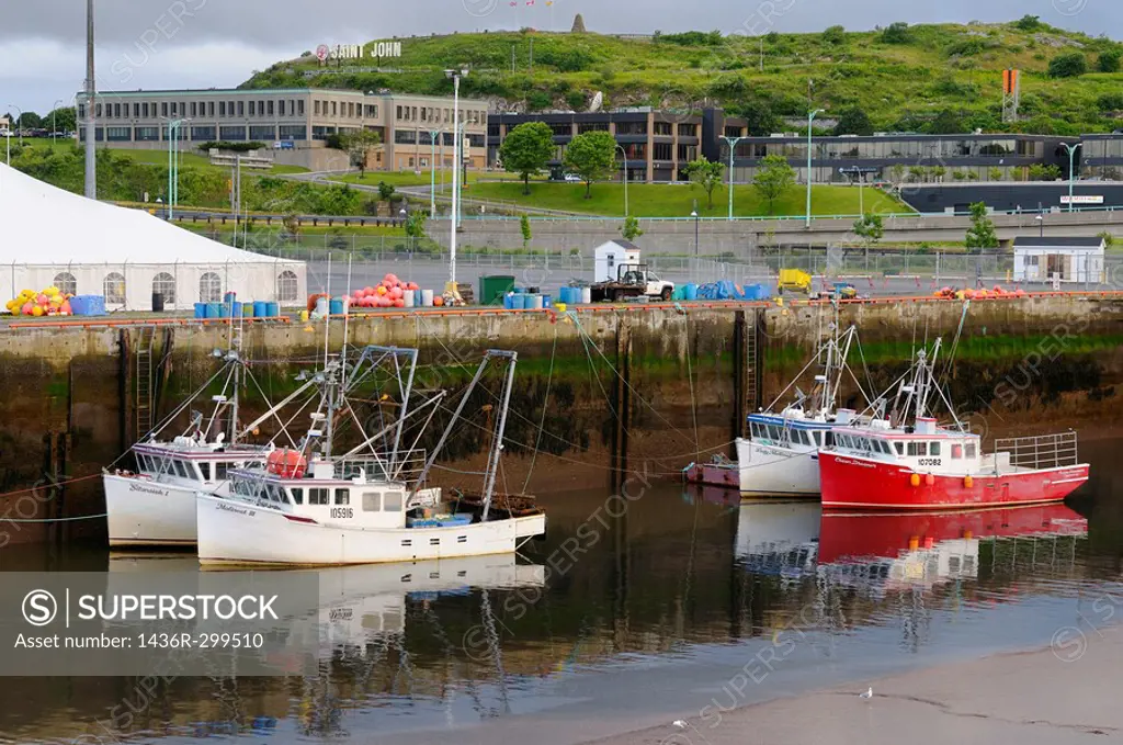 Fishing boats at dawn and low tide in Saint John Harbour New Brunswick