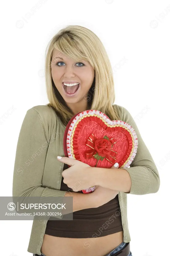 Young Caucasian woman very excited after recieving a special gift