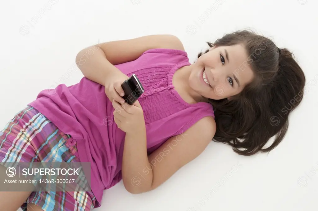 Cute Caucasian girls texting on a cell phone