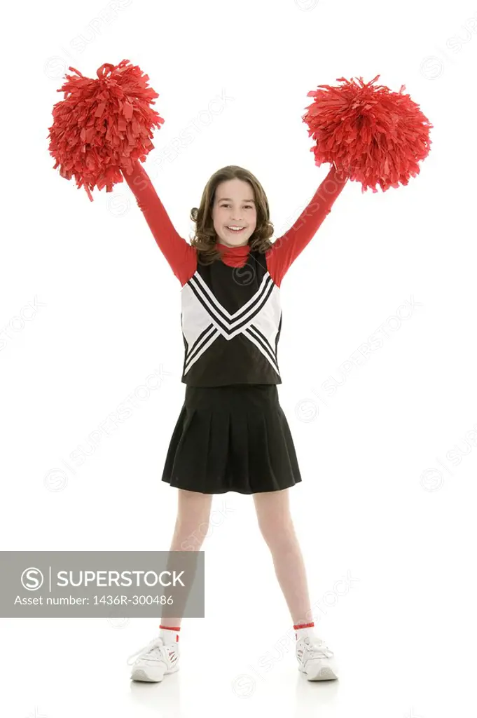 Ten year old caucasian girl dressed as cheerleader