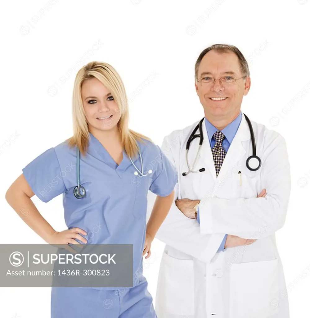 Successful doctors smiling over a white background