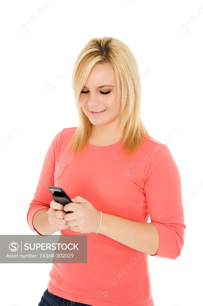 Beautiful Caucasian woman text messaging on white background