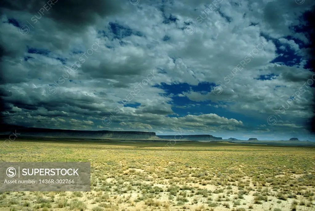 Dramatic cloudy sky passing over the rock formations in Monument Valley, Arizona, USA.