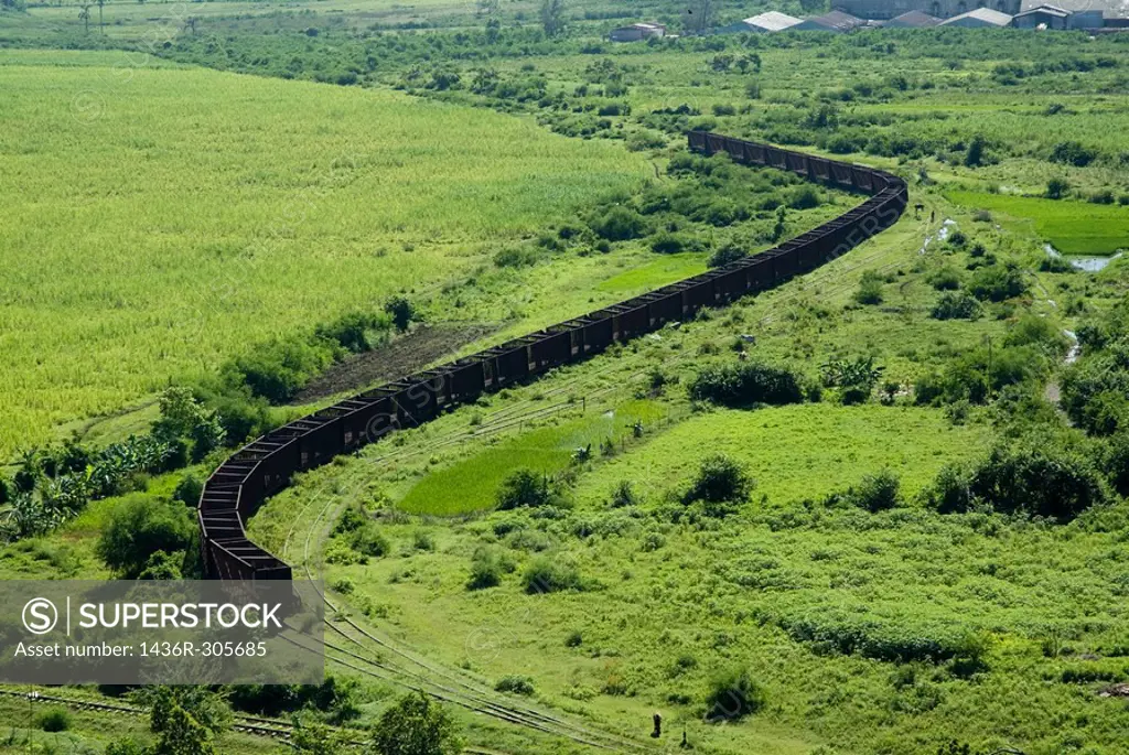 Long line of train wagons which were used for transportation on the former sugar cane plantation Manaca-Iznaga, Cuba.