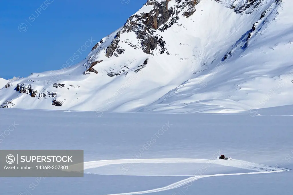 Preparations of cross-country tracks on the snow field of the Plaine Morte Glacier, ski resort Crans Montana, Valais, Switzerland