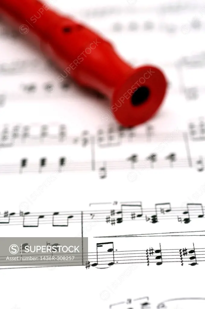 red flute on music sheet