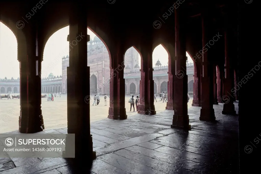 Pillared corridor in Diwan-e-Khas in Fatehpur Sikri built during second half of 16th century made from red sandstone , capital of Mughal empire , Agra...