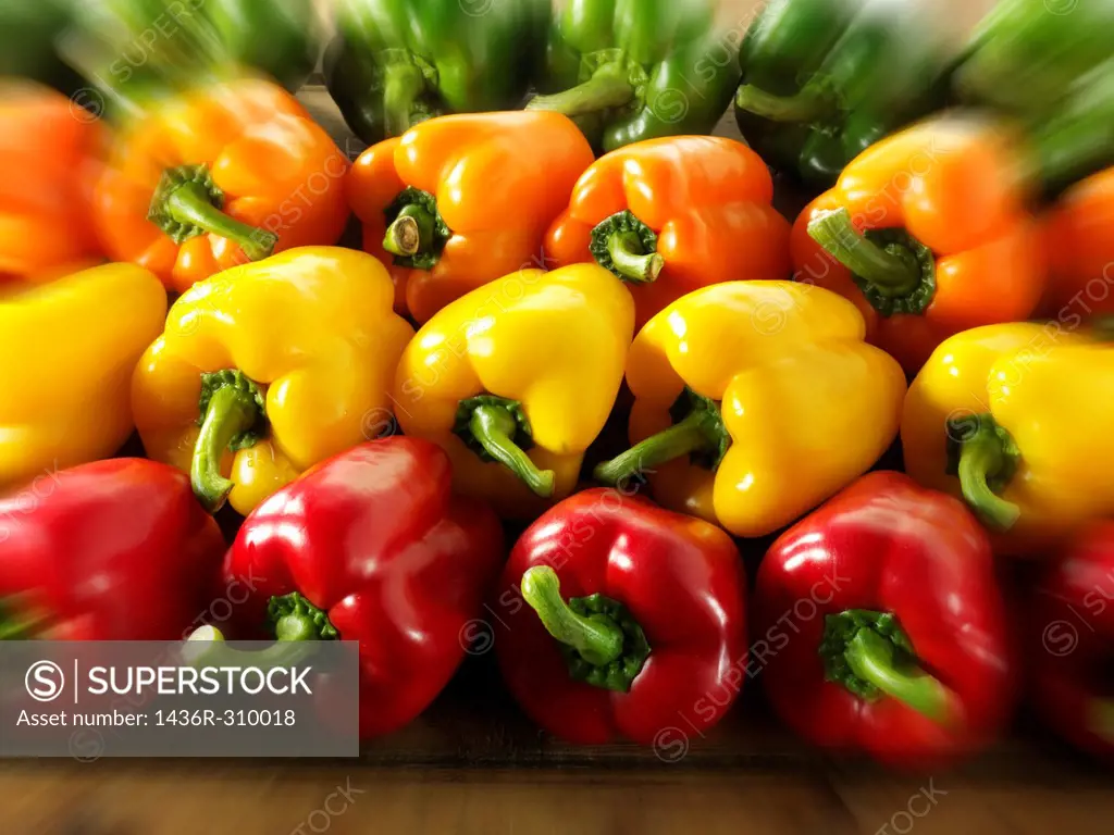 Mixed red, green, yellow & orange fresh bell peppers photos, pictures & images