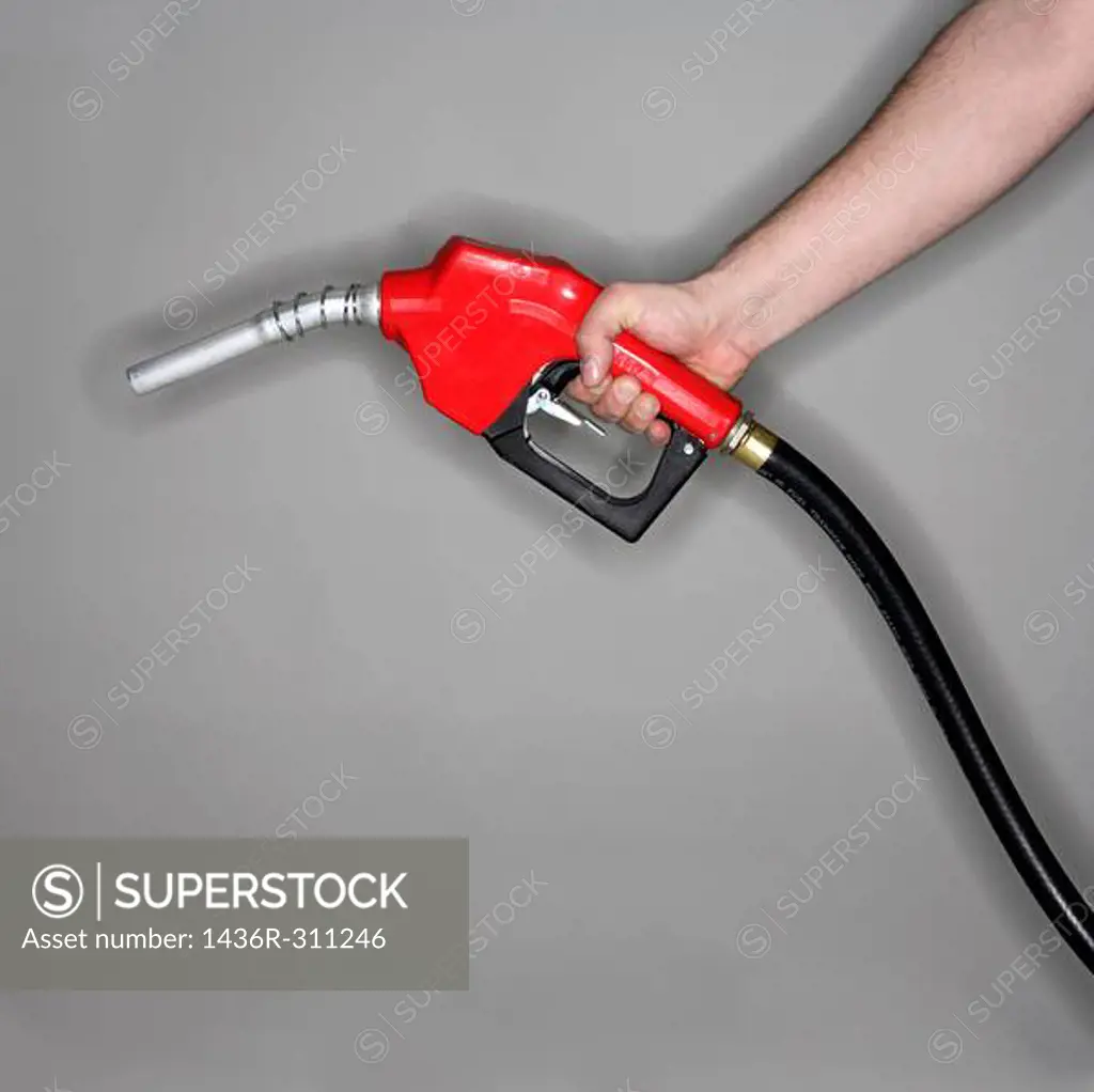 Man holding gas nozzle