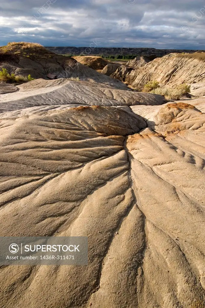 fan-shaped erosion pattern in badlands,landscape view from low perspective
