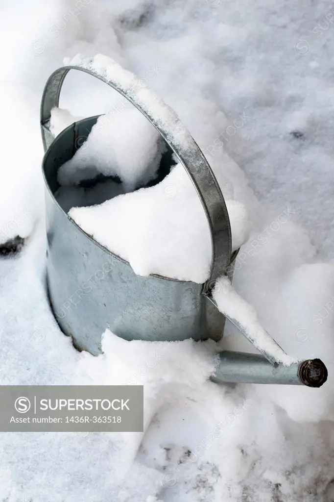 A watering can that was left outside in the Winter