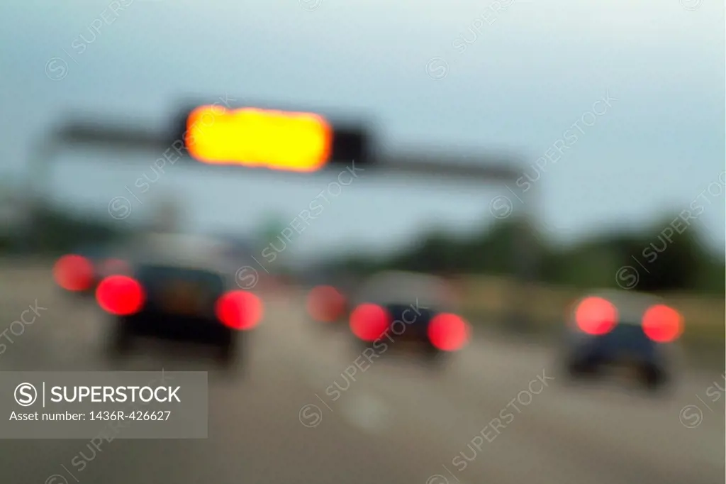 Blurred tail lights of cars travelling on a highway, Paris, France