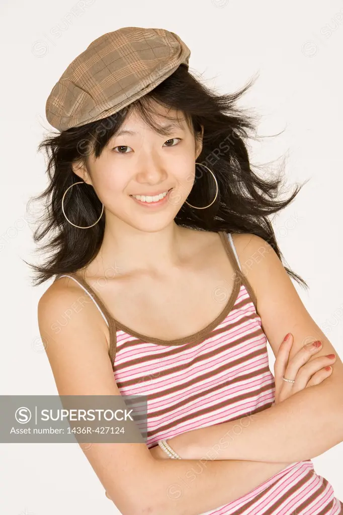 Portrait of a beautiful Asian teenager on a white background