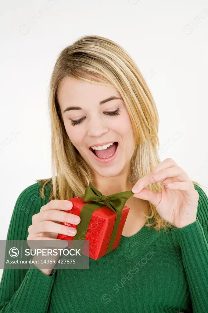 Young woman excited after recieving a special gift