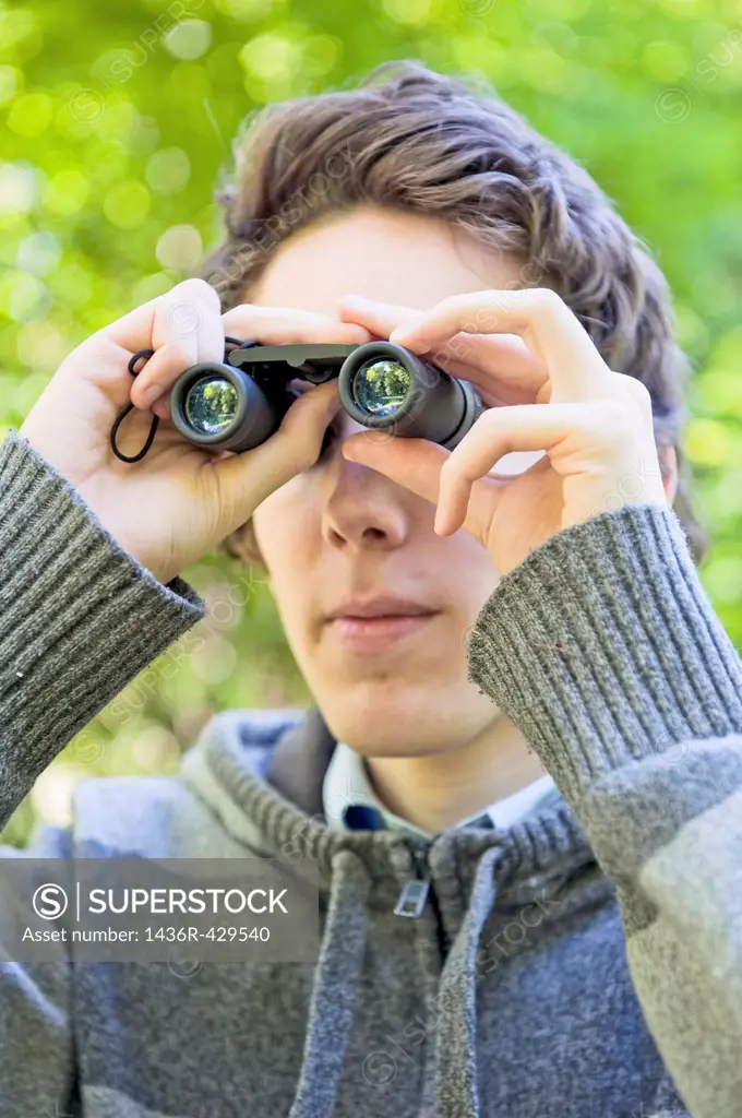 Young man birdwatching